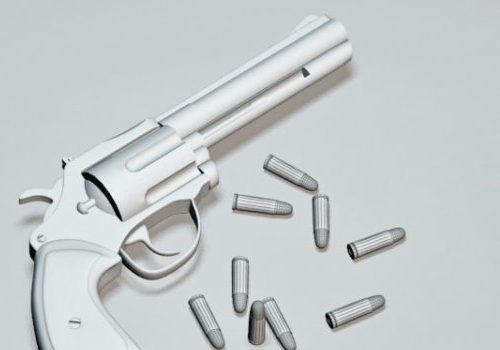 Silver Revolver With Bullets
